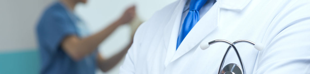 A man in a white medical lab coat.